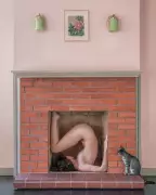 Brooke DiDonato's Best Photograph: Nude in a Fireplace with a Curious Kitten