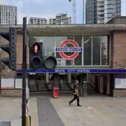 Manhunt after children kicked at White City Tube station