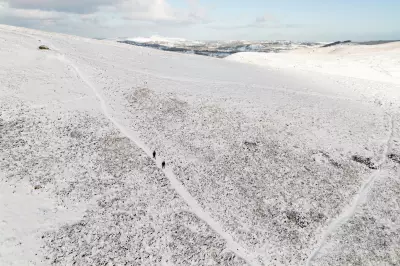 Global Snapshot: Snow in Wales, Gaza Flooding & Wolf Supermoon Mark Friday