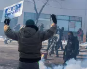 Federal Agents Deploy Tear Gas After Fatal Shooting Sparks Minneapolis Protests
