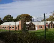 First Asylum Seekers Arrive at East Sussex Camp Amid Protest Fears