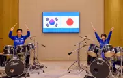 Leaders in Rhythm: Japan and South Korea Drum Up Diplomacy with K-Pop Performance