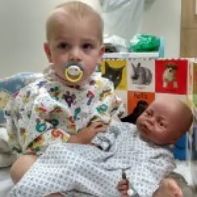 Gyles Brandreth Reveals Grandson's Childhood Cancer Battle and Calls for Kinder Treatments