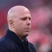 Carragher Warns Slot's Liverpool Future Hangs on Champions League Qualification