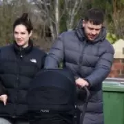 Isabel Hodgins Radiant in First Outing with Newborn Daughter Georgie Grace