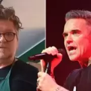 Songwriter Reignites 30-Year Feud Over Robbie Williams' Hit 'Angels'