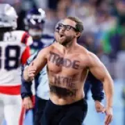 Super Bowl Streaker Halted by Patriots Star After Cryptic Message Display