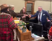 Wyoming Political Scandal: Far-Right Activist Hands Checks to Lawmakers on House Floor