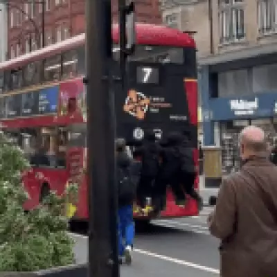 Teenagers Risk Lives Bus Surfing on Oxford Street in Dangerous Stunt