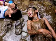 Mark Linel's Padecios Captures Joyful Children in Muddy Play