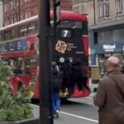 Teenagers Risk Lives Bus Surfing on Oxford Street in Dangerous Stunt