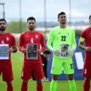 Iran Footballers Display Images of Child Victims in US-Israel Strikes