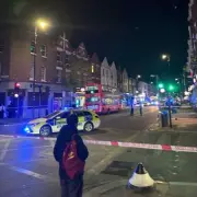 Man in his 40s stabbed on busy North London street, attacker at large