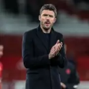 Michael Carrick Defends Manuel Ugarte Amid Gary Neville's Criticism