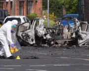 New IRA Suspected in Car Bomb Outside Belfast Police Station