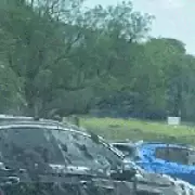 Farmer sprays slurry on luxury cars parked illegally in Lake District field