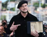 John Travolta's Beret Trend: Dressing for the Job You Want at Cannes