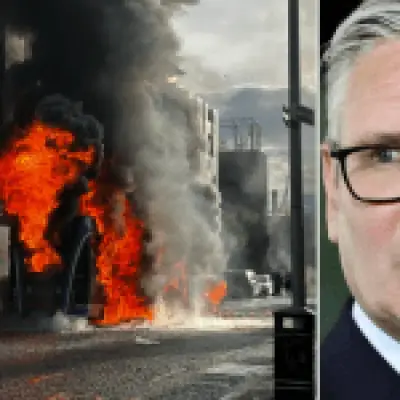 Violence condemned after Tommy Robinson stokes Belfast riots; man stabbed