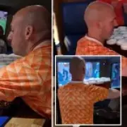 Dutch fan carries 26 pints of beer in one go at Scottish pub