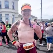 Mum, 56, becomes first woman to complete ultramarathon topless for cancer awareness