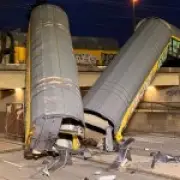 One dead after freight train derails and falls off bridge in Munich crash