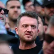 Tommy Robinson detained at Heathrow, begs supporters for cash