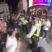 Lone Argentina fan rescued by police after England fans swarm him in London