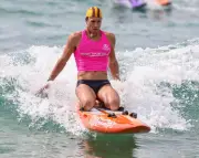 Paddleboarder who rescued shark attack victim wins world title in record time