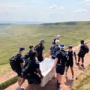 Rugby academy players remove bath left by influencer on Pen y Fan