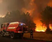 Thousands flee wildfires in France as southern Europe bakes in extreme heat