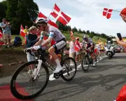 Tour de France director denies bias toward French riders, backs night tests