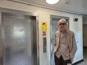 Woman trapped in lift with broken call button; residents told to carry phone