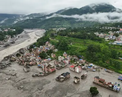 Australians missing in Nepal floods; refugee intake to be cut