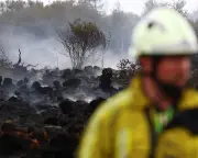 Belgian firefighters race to encircle largest wildfire in a century