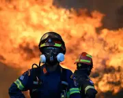 Helicopter collision kills 2 as wildfires threaten Athens