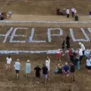 Kent villagers spell out 'help us' with 6,000 plastic bottles after week without water
