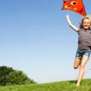 Kites in Parks Signal Childhood Fun Endures Beyond Screens