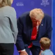 Trump stops toddler's fall, takes jab at Biden in Nevada