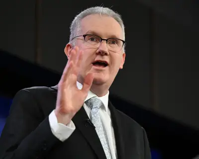 Burke defends Labor's immigration plan delay, blames Coalition