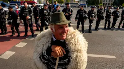 Global photos: Romania protests, Emmys, Gaza burial, rocket launch