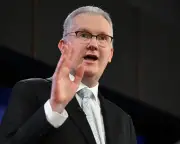 Burke defends Labor's immigration plan delay, blames Coalition