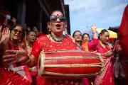 Global Photos: Teej Festival, Wildfires, Ferry Rescue, Protests