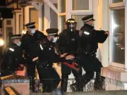 Met Police officer stabbed as 17 arrested in major organised crime raids