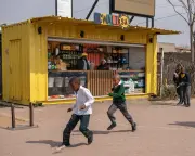 South Africa's weigh-and-pay shops fight 'poverty tax' in townships