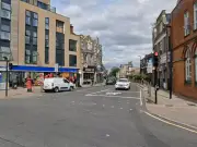 Man in 30s critical after Woolwich shooting; police hunt suspect